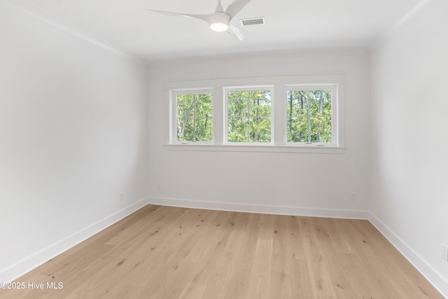 3404 Eagle Crest Dr SW, Supply, NC 28462 - empty room featuring plenty of natural light, light wood finished floors, a ceiling fan, and crown molding