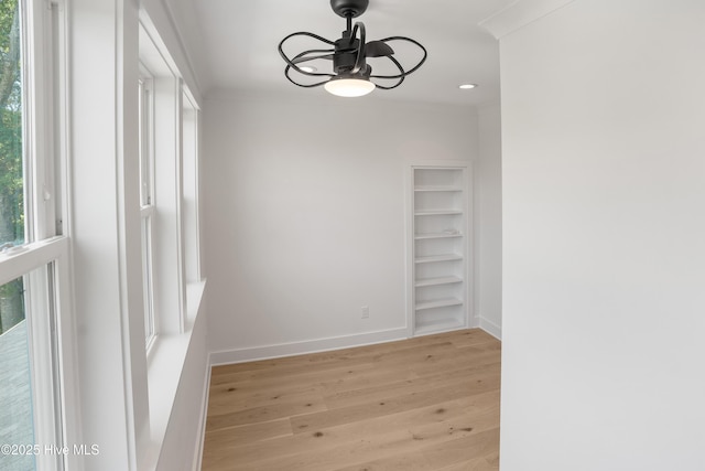 3404 Eagle Crest Dr SW, Supply, NC 28462 - empty room featuring light wood-style floors, ceiling fan, built in shelves, and recessed lighting