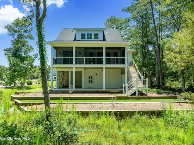 3404 Eagle Crest Dr SW, Supply, NC 28462 - rear view of property featuring a sunroom, stairway, a patio, and a ceiling fan