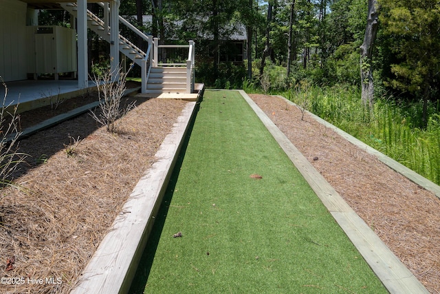 3404 Eagle Crest Dr SW, Supply, NC 28462 - surrounding community featuring a game area and stairs