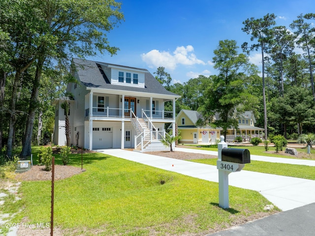 3404 Eagle Crest Dr SW, Supply, NC 28462 - view of front of house with a porch, stairs, an attached garage, and a front yard