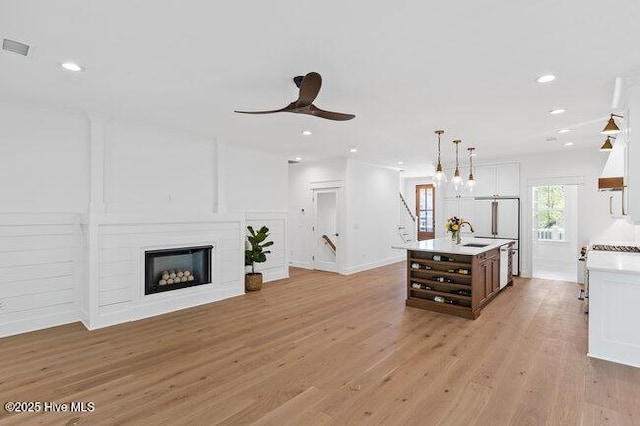3404 Eagle Crest Dr SW, Supply, NC 28462 - living area with light wood-style floors, a ceiling fan, recessed lighting, and a fireplace
