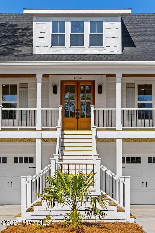 3404 Eagle Crest Dr SW, Supply, NC 28462 - doorway to property with an attached garage, a porch, and roof with shingles