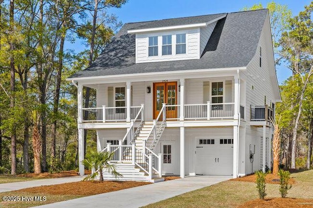 3404 Eagle Crest Dr SW, Supply, NC 28462 - coastal inspired home featuring a porch, stairway, a garage, driveway, and roof with shingles