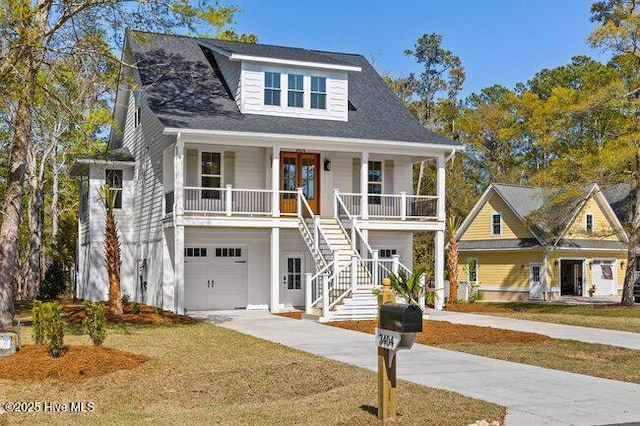 3404 Eagle Crest Dr SW, Supply, NC 28462 - view of front of home featuring a porch, stairs, driveway, an attached garage, and a front lawn