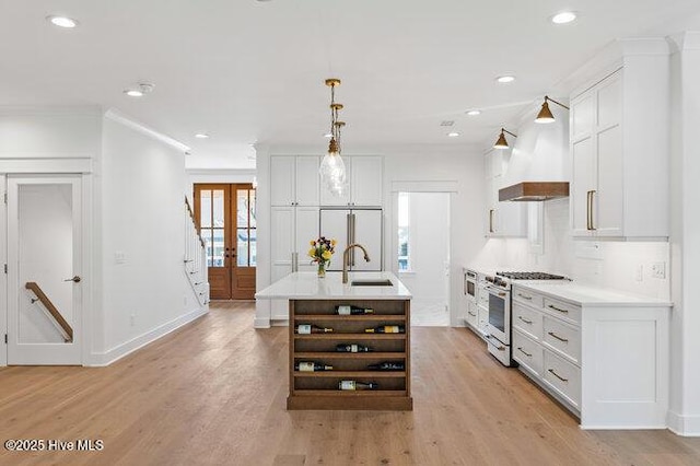 3404 Eagle Crest Dr SW, Supply, NC 28462 - kitchen with stainless steel range, open shelves, premium range hood, light countertops, and recessed lighting