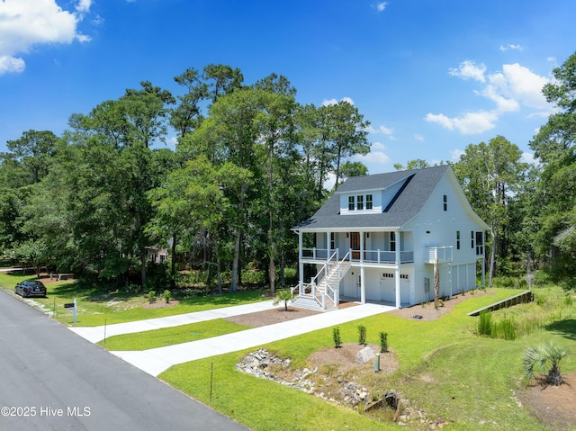 3404 Eagle Crest Dr SW, Supply, NC 28462 - view of front of property featuring a porch, a front yard, an attached garage, and concrete driveway