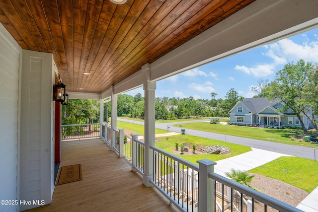 3404 Eagle Crest Dr SW, Supply, NC 28462 - wooden porch featuring a yard and view of wooded area