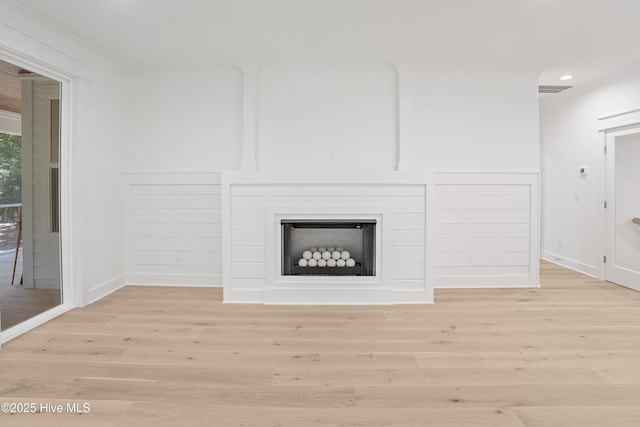 3404 Eagle Crest Dr SW, Supply, NC 28462 - unfurnished living room with light wood finished floors, ornamental molding, a fireplace, and recessed lighting