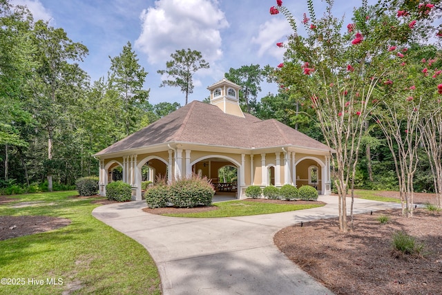 6857 Beckman Cir SW Unit 55, Ocean Isle Beach, NC 28469 - view of home's community featuring a yard and curved driveway