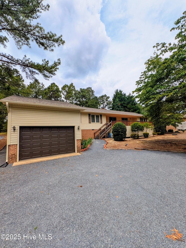 102 Thistle Ln, West End, NC 27376 - ranch-style house featuring brick siding, driveway, and a garage