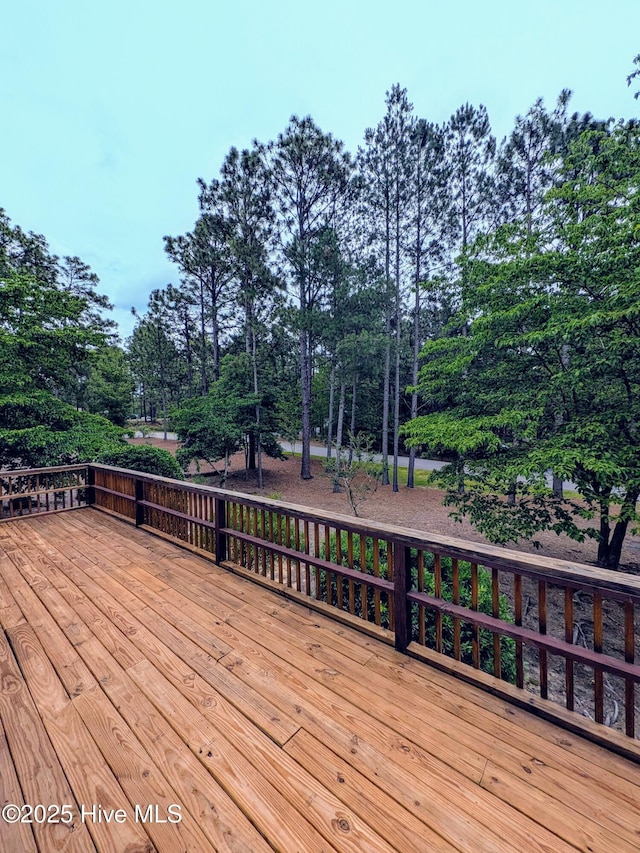 102 Thistle Ln, West End, NC 27376 - wooden deck with view of wooded area