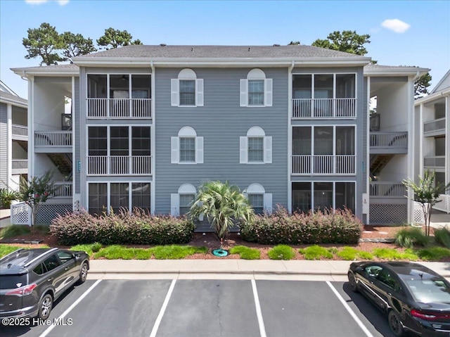 145 Royal Poste Rd # 3110, Sunset Beach, NC 28468 - view of property featuring uncovered parking