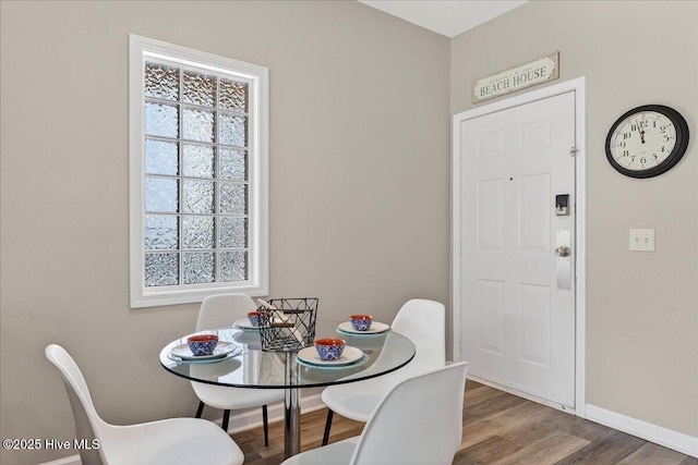 145 Royal Poste Rd # 3110, Sunset Beach, NC 28468 - dining space featuring baseboards and wood finished floors