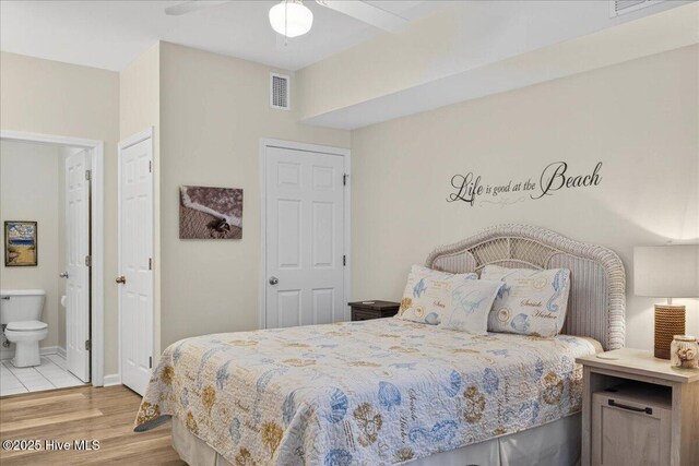 145 Royal Poste Rd # 3110, Sunset Beach, NC 28468 - bedroom with light wood finished floors, connected bathroom, and ceiling fan