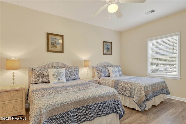 145 Royal Poste Rd # 3110, Sunset Beach, NC 28468 - bedroom with wood finished floors and ceiling fan
