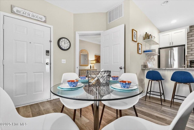 145 Royal Poste Rd # 3110, Sunset Beach, NC 28468 - dining space with wood finished floors