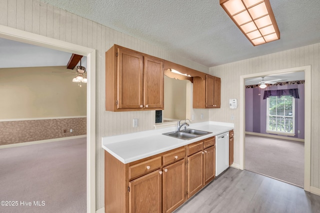 26 Combine Ln SE, Leland, NC 28451 - kitchen featuring white dishwasher, a ceiling fan, wallpapered walls, light countertops, and a textured ceiling