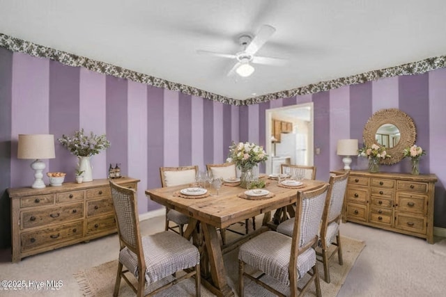 26 Combine Ln SE, Leland, NC 28451 - dining space with light carpet, a ceiling fan, and wallpapered walls