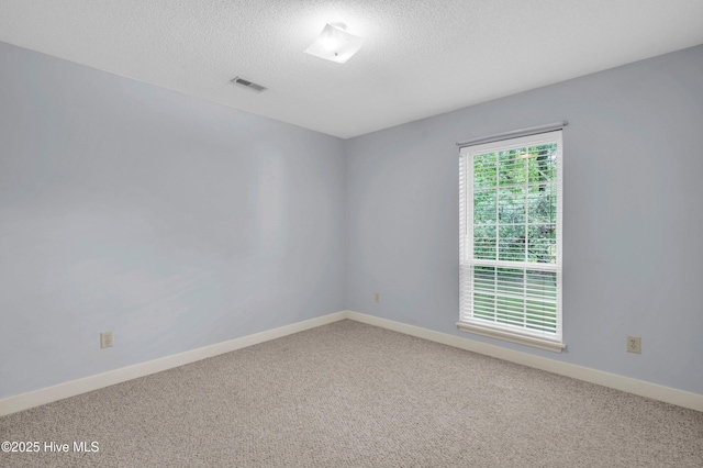 26 Combine Ln SE, Leland, NC 28451 - empty room featuring carpet floors and a textured ceiling