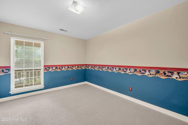 26 Combine Ln SE, Leland, NC 28451 - carpeted spare room with a textured ceiling and baseboards