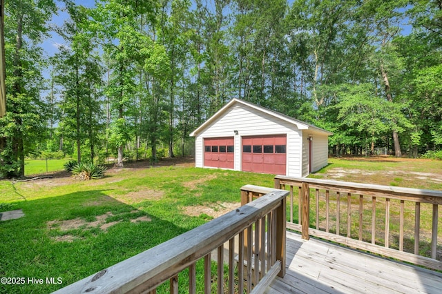 26 Combine Ln SE, Leland, NC 28451 - view of grassy yard featuring a garage, an outbuilding, a deck, and view of wooded area