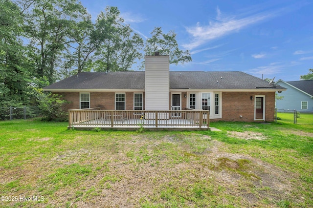 26 Combine Ln SE, Leland, NC 28451 - rear view of house featuring brick siding, a deck, and a chimney