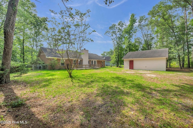 26 Combine Ln SE, Leland, NC 28451 - view of yard featuring a wooden deck