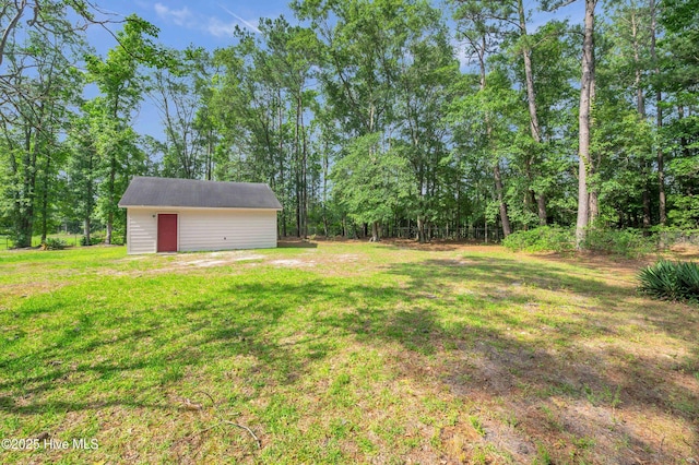 26 Combine Ln SE, Leland, NC 28451 - view of green lawn with an outdoor structure