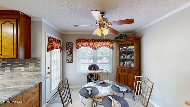 955 Spring Bank Rd, Goldsboro, NC 27534 - dining room with a ceiling fan, a textured ceiling, ornamental molding, and light carpet