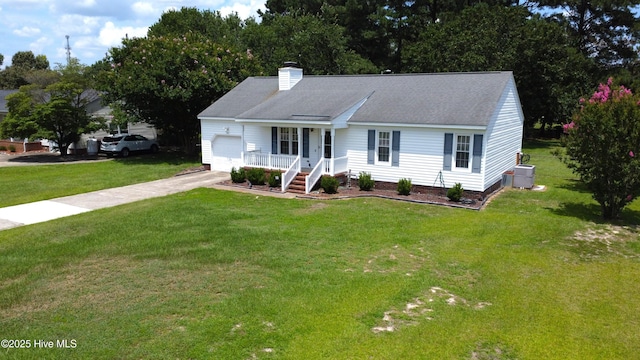 955 Spring Bank Rd, Goldsboro, NC 27534 - view of front facade with driveway, an attached garage, a front yard, a chimney, and roof with shingles