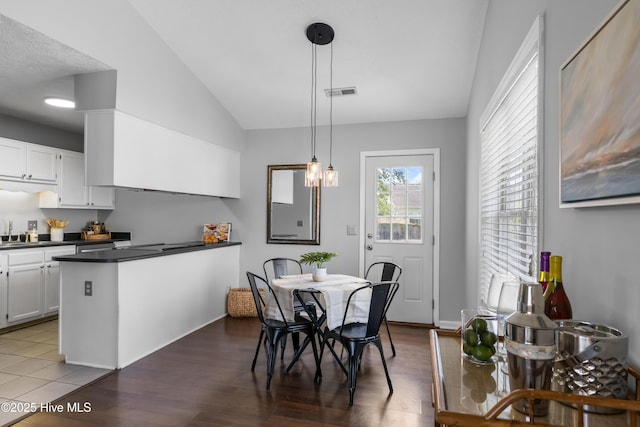 2418 Bradfield Ct, Wilmington, NC 28411 - dining area with vaulted ceiling and wood finished floors