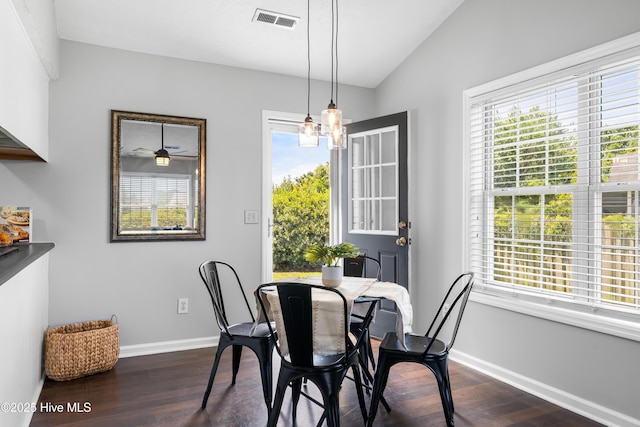 2418 Bradfield Ct, Wilmington, NC 28411 - dining area with dark wood finished floors, healthy amount of natural light, lofted ceiling, and a chandelier
