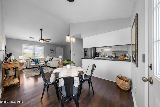 2418 Bradfield Ct, Wilmington, NC 28411 - dining space with ceiling fan, dark wood-type flooring, and vaulted ceiling