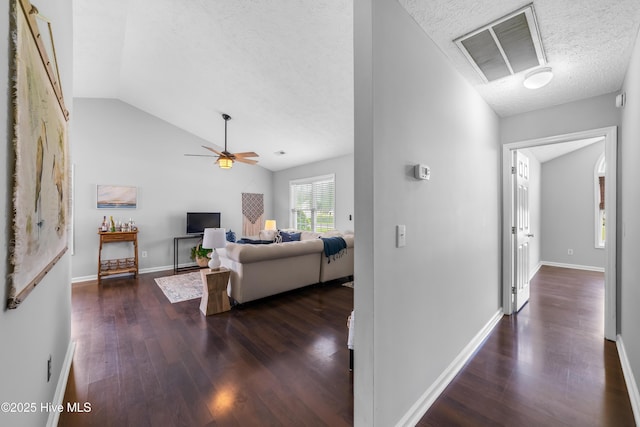 2418 Bradfield Ct, Wilmington, NC 28411 - hall featuring dark wood-type flooring, lofted ceiling, and a textured ceiling