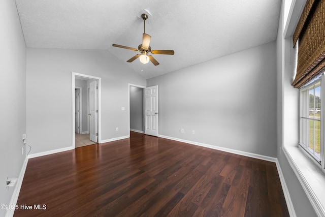 2418 Bradfield Ct, Wilmington, NC 28411 - unfurnished bedroom with wood finished floors, vaulted ceiling, a ceiling fan, and a textured ceiling