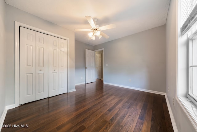 2418 Bradfield Ct, Wilmington, NC 28411 - unfurnished bedroom featuring dark wood-style flooring, a closet, and ceiling fan