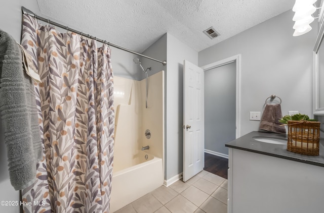 2418 Bradfield Ct, Wilmington, NC 28411 - bathroom with tile patterned flooring, shower / tub combo, vanity, and a textured ceiling