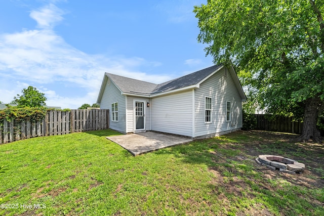 2418 Bradfield Ct, Wilmington, NC 28411 - rear view of property with a fire pit, a patio, and a fenced backyard