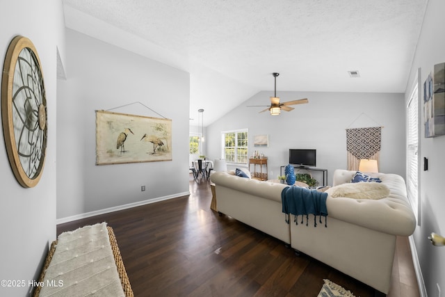 2418 Bradfield Ct, Wilmington, NC 28411 - living room with wood finished floors, a ceiling fan, vaulted ceiling, and a textured ceiling