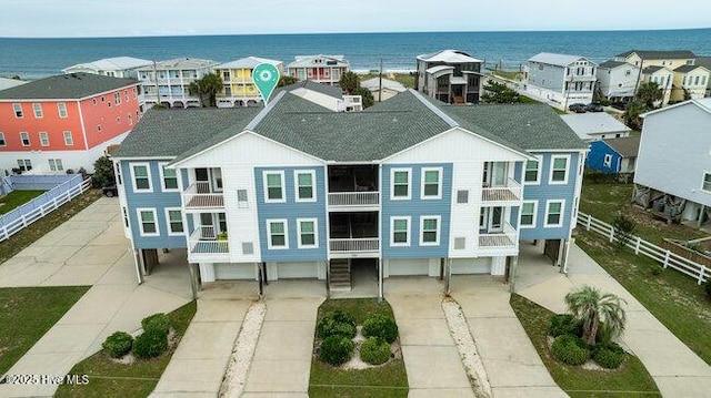1701 Bowfin Ln Unit B, Carolina Beach, NC 28428 - view of front of home featuring a water view, a residential view, and concrete driveway