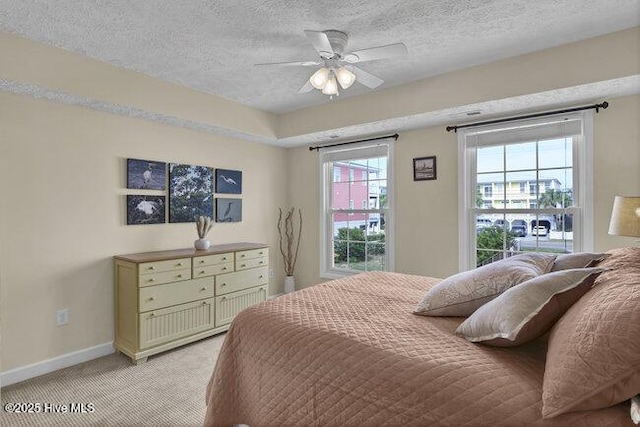 1701 Bowfin Ln Unit B, Carolina Beach, NC 28428 - bedroom featuring a textured ceiling, light colored carpet, and ceiling fan