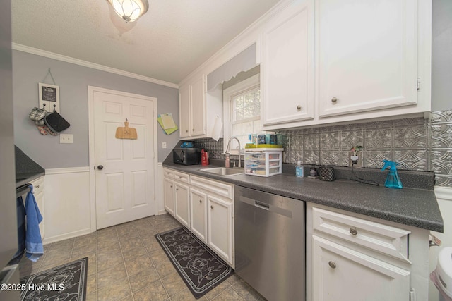 113 Lakehurst Dr, Dudley, NC 28333 - kitchen featuring stainless steel dishwasher, black microwave, dark countertops, white cabinets, and crown molding