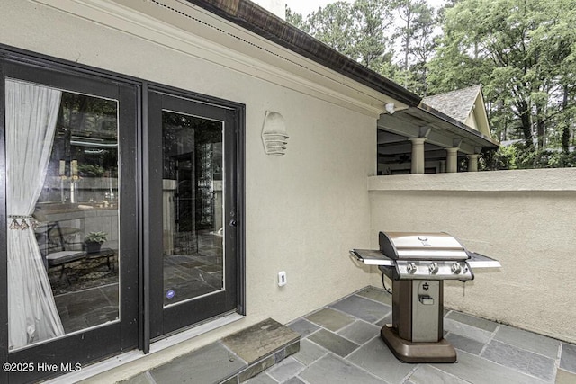 129 Steeplechase Rd, Rocky Mount, NC 27804 - doorway to property with stucco siding and a patio