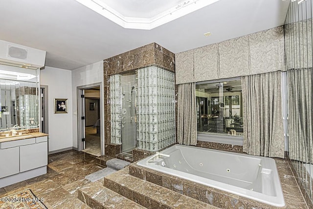 129 Steeplechase Rd, Rocky Mount, NC 27804 - full bath featuring vanity, a jetted tub, and a shower stall