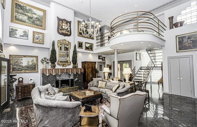129 Steeplechase Rd, Rocky Mount, NC 27804 - living room with a towering ceiling, a fireplace with raised hearth, stairs, granite floors, and a chandelier