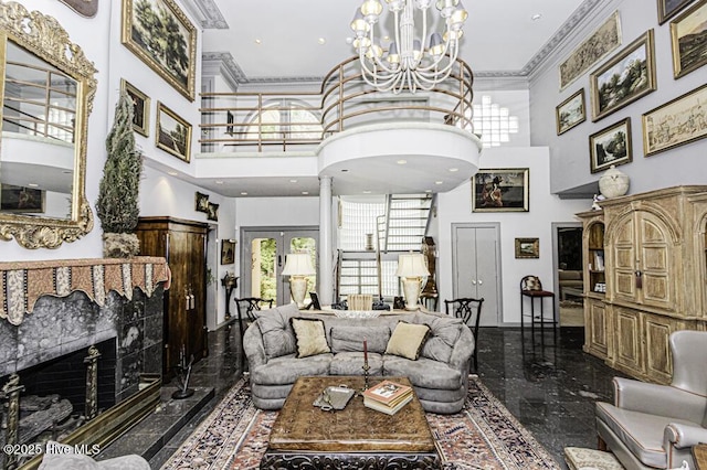 129 Steeplechase Rd, Rocky Mount, NC 27804 - living room featuring a towering ceiling, granite tiled floors, a chandelier, french doors, and ornamental molding