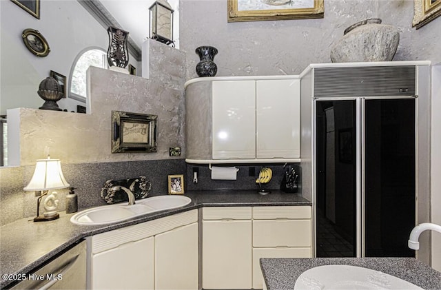 129 Steeplechase Rd, Rocky Mount, NC 27804 - kitchen with tasteful backsplash, white cabinetry, dark countertops, and high end black refrigerator