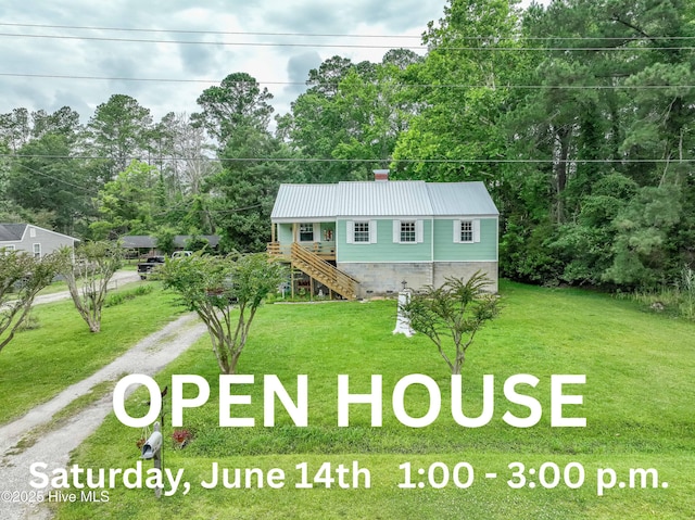 766 Swan Point Rd, Washington, NC 27889 - view of front of property with stairway, driveway, a front yard, and a metal roof