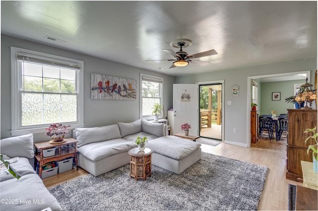 766 Swan Point Rd, Washington, NC 27889 - living room with a ceiling fan and light wood-style floors